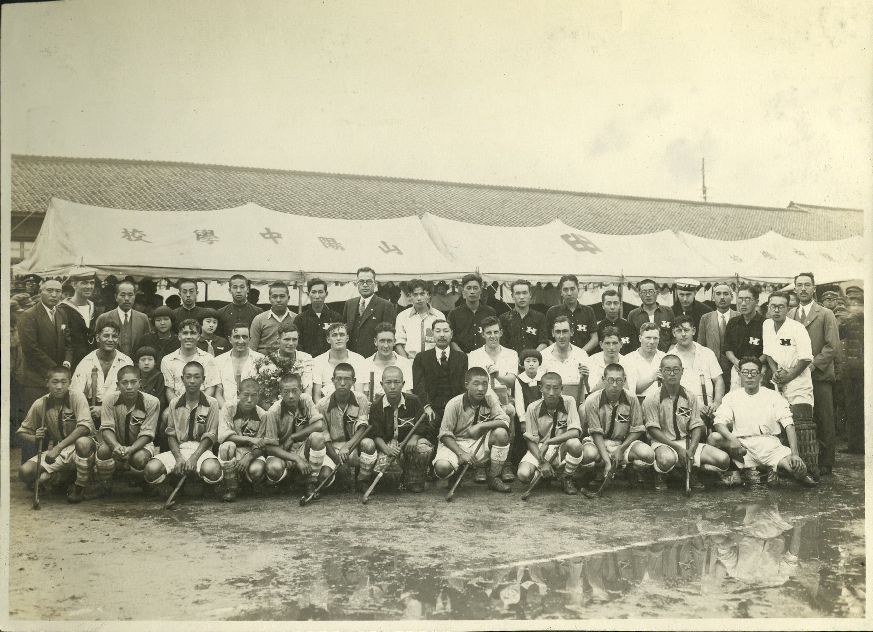 Sanyo Junior High School hockey team hosts a western hockey team during a sports festival in Hiroshima, ca. 1935.