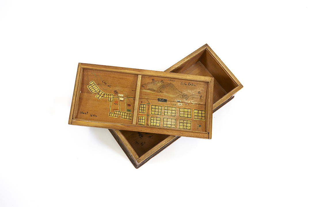 Handcrafted wood box with sketches of Tule Lake and Hunt, Idaho (Minidoka) Relocation Camps, 1943.
