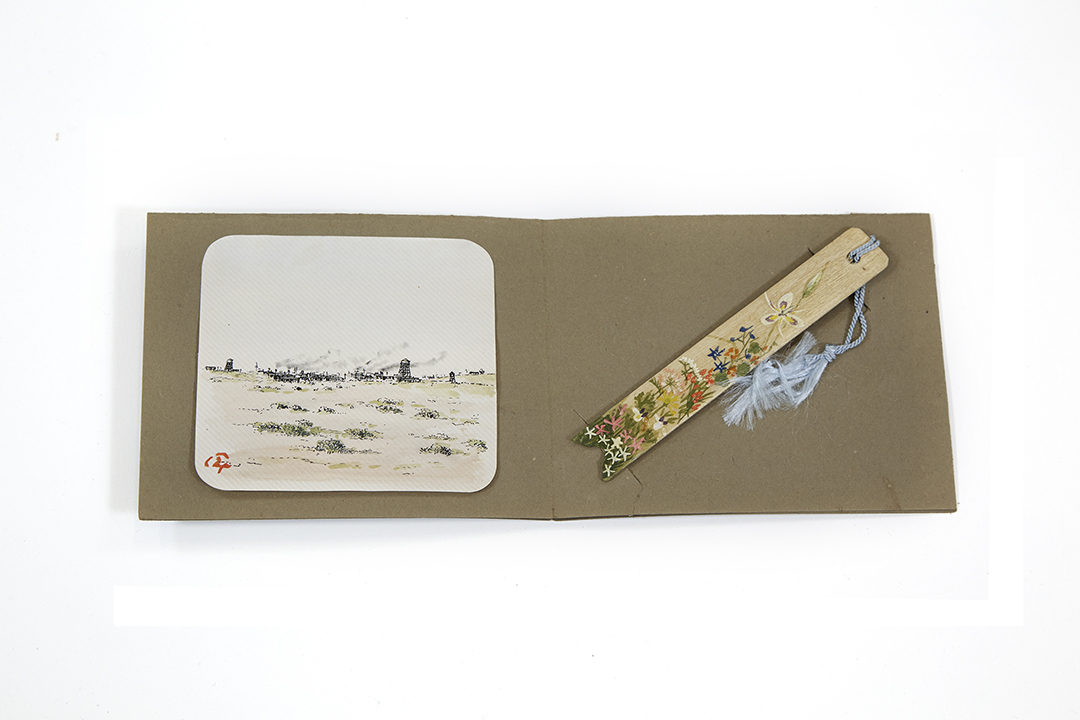 Olive green folio with envelope titled “From: Mr. Izui Camp Remembrance,” ca. 1942.